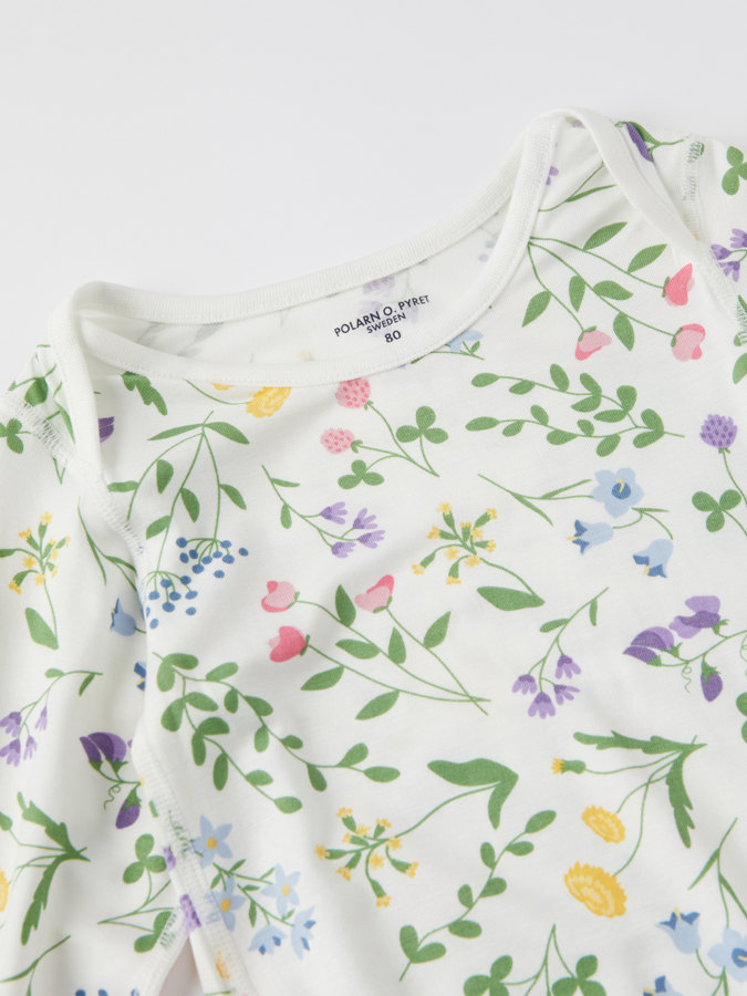 Floral babygrow with envelope neckline