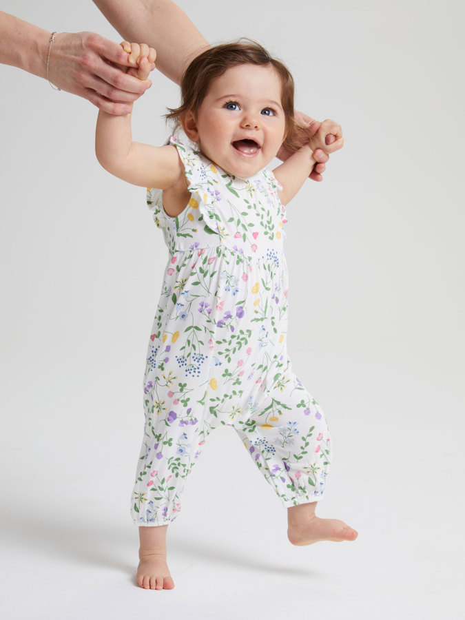 Short-sleeved playsuit with ruffle