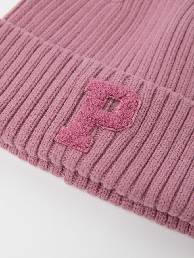Solid color, ribbed beanie with "P" appliqué