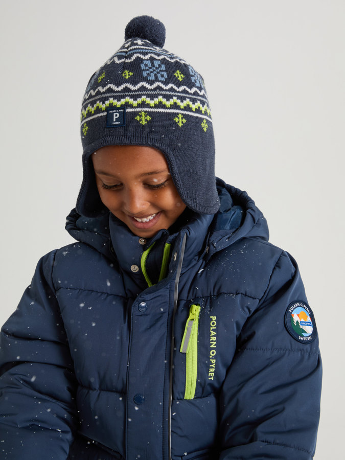 Windproof fleece lined hat in wool blend jacquard