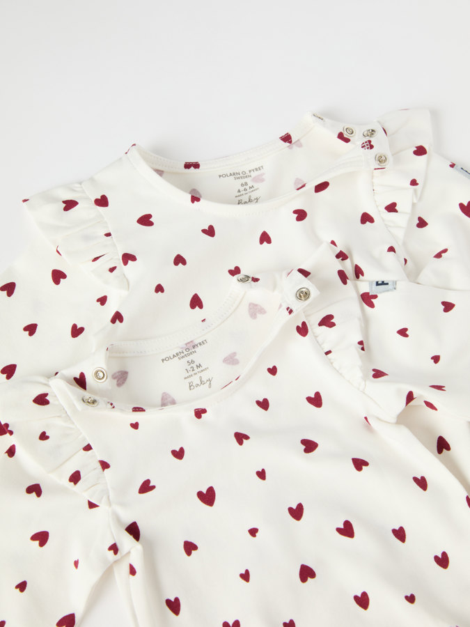 babygrow with heart print and ruffles